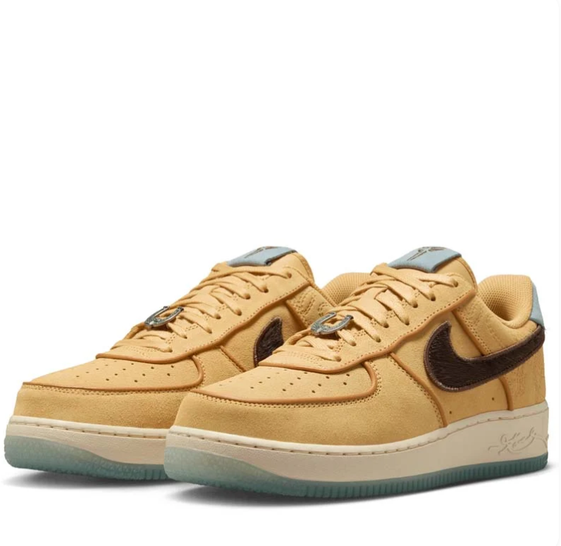 Nike Golden Tan Low-Top Sneakers with Dark Brown Swoosh and Pale Blue Accents
