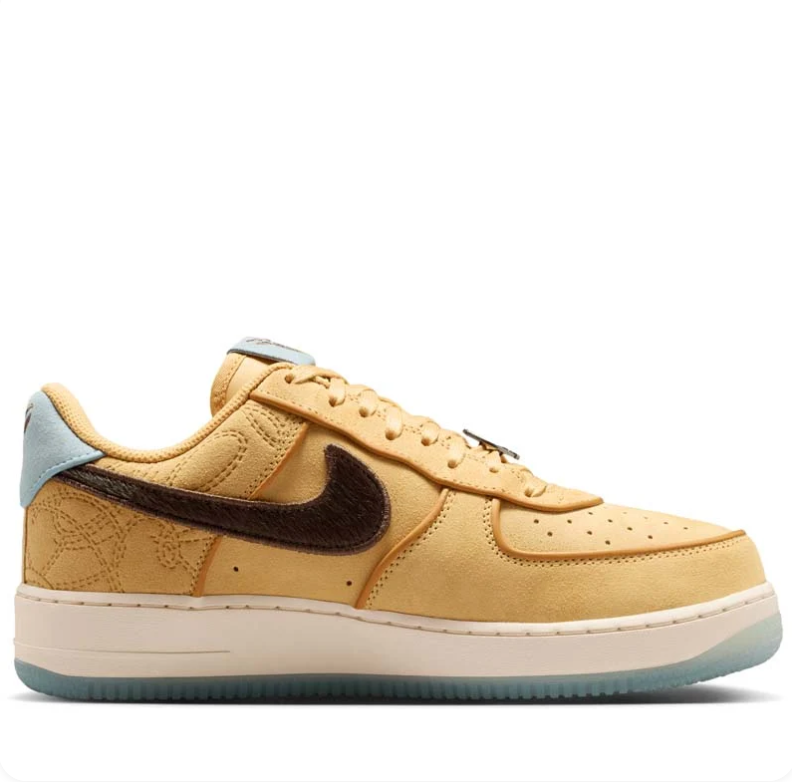 Nike Golden Tan Low-Top Sneakers with Dark Brown Swoosh and Pale Blue Accents