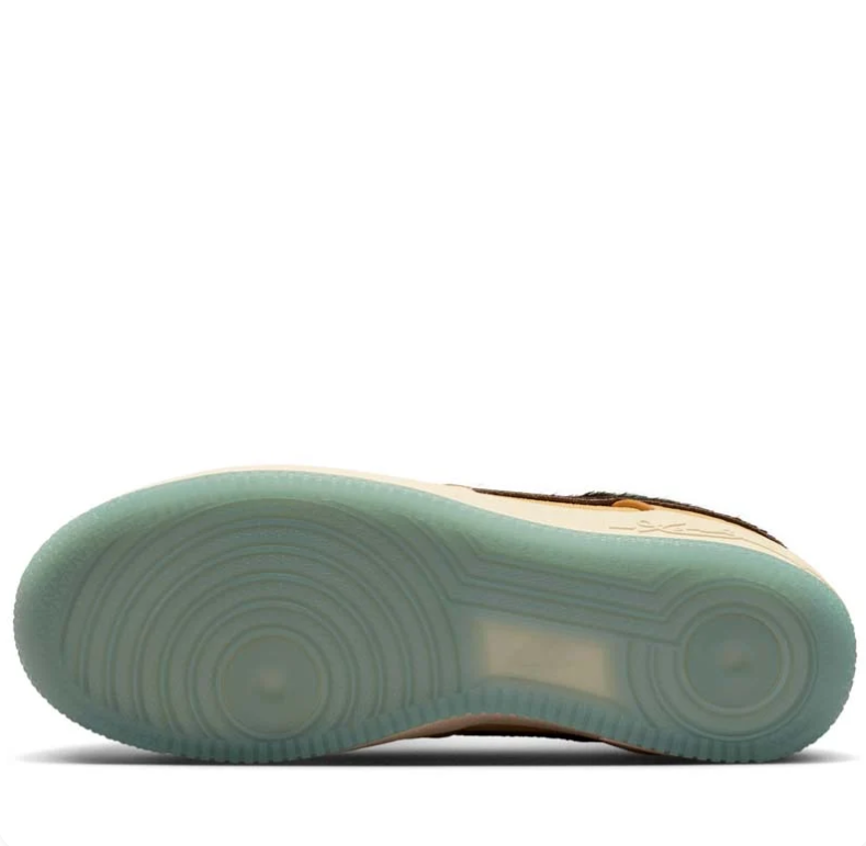 Nike Golden Tan Low-Top Sneakers with Dark Brown Swoosh and Pale Blue Accents