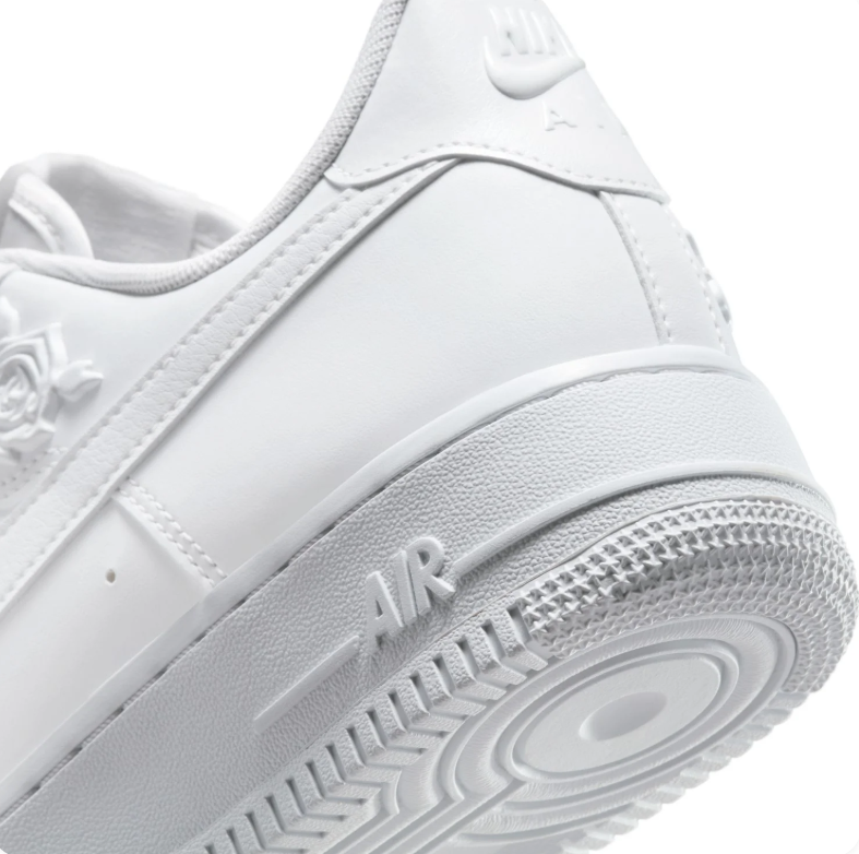 Nike White Low-Top Sneakers with Raised Rose Details