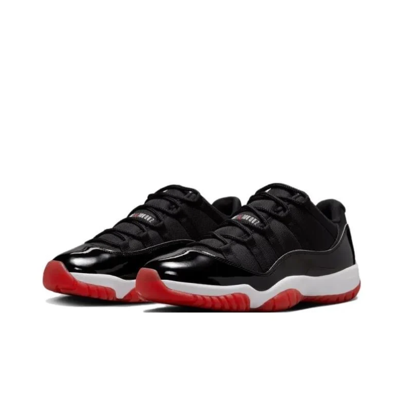 Jordan Black Low-Top Sneakers with Glossy Panels and Red Outsole
