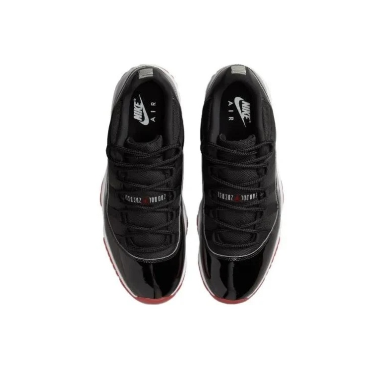 Jordan Black Low-Top Sneakers with Glossy Panels and Red Outsole